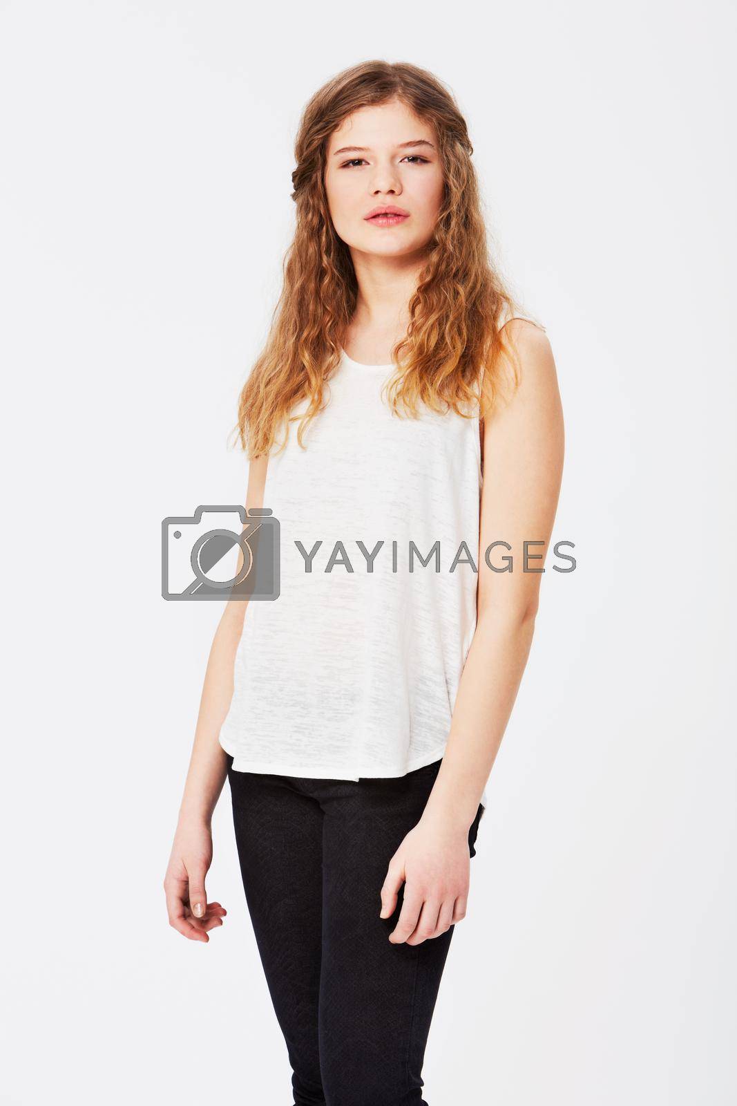 Royalty free image of Effortlessly beautiful. Isolated image of a caucasian girl in casual clothing. by YuriArcurs