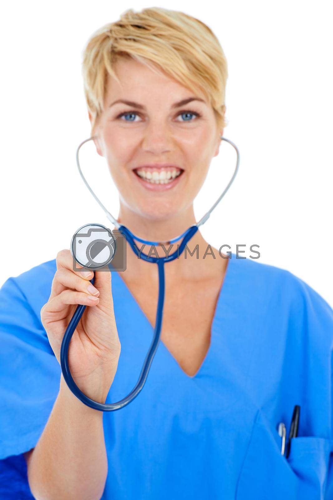 Royalty free image of Ready for a checkup. A young smiling doctor holding her stethoscope up to the camera. by YuriArcurs