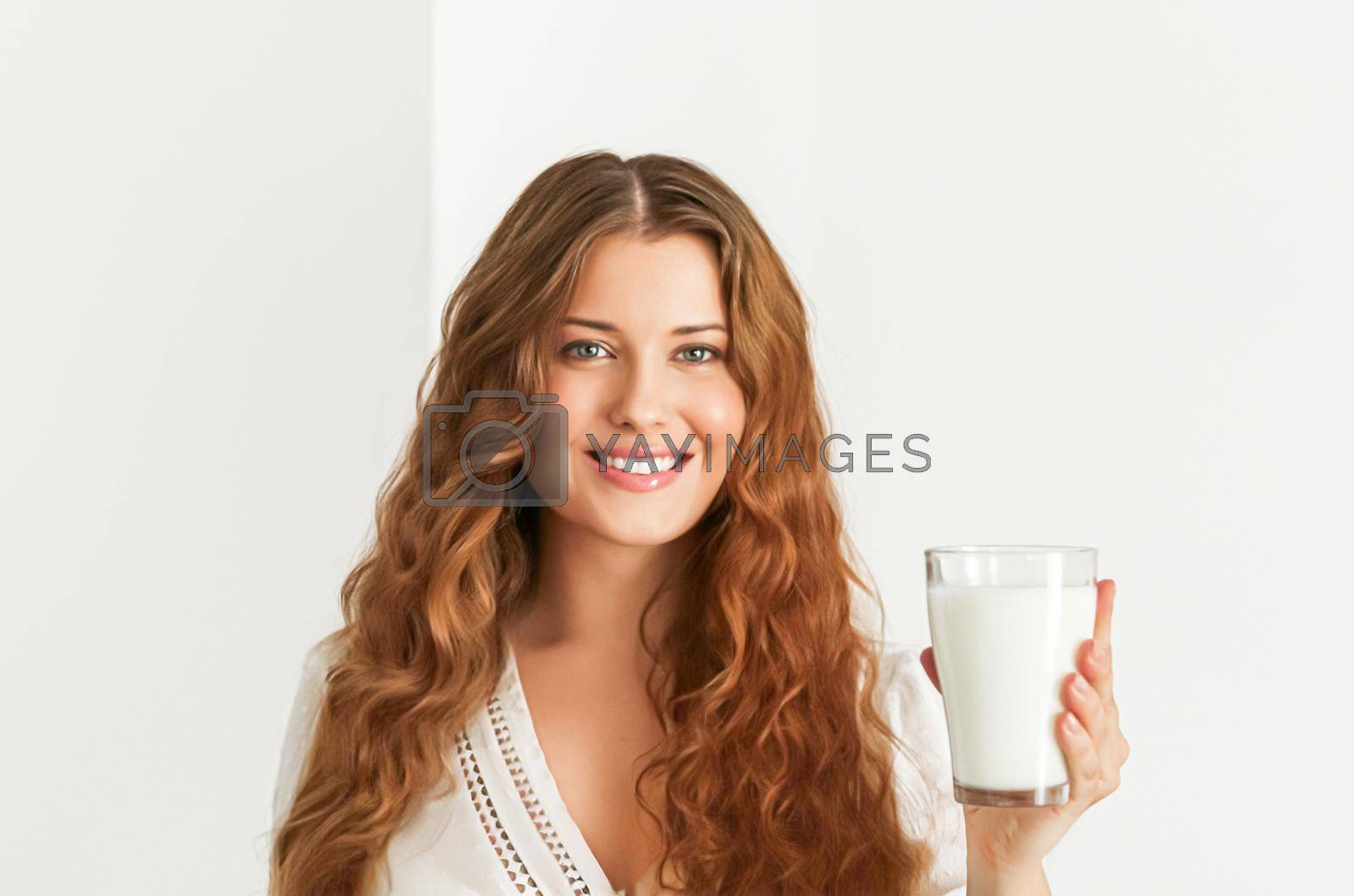Royalty free image of Diet, health and wellness, woman holding glass of milk or protein shake cocktail by Anneleven