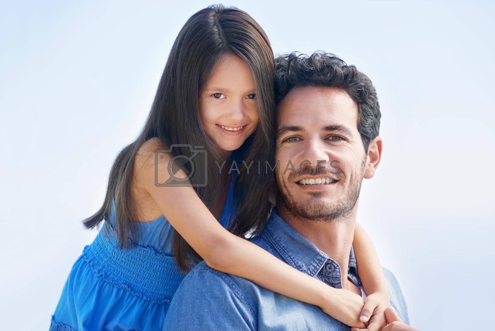 Royalty free image of Portrait of father and daughter bond. Outdoor portrait of a smiling father and daughter. by YuriArcurs