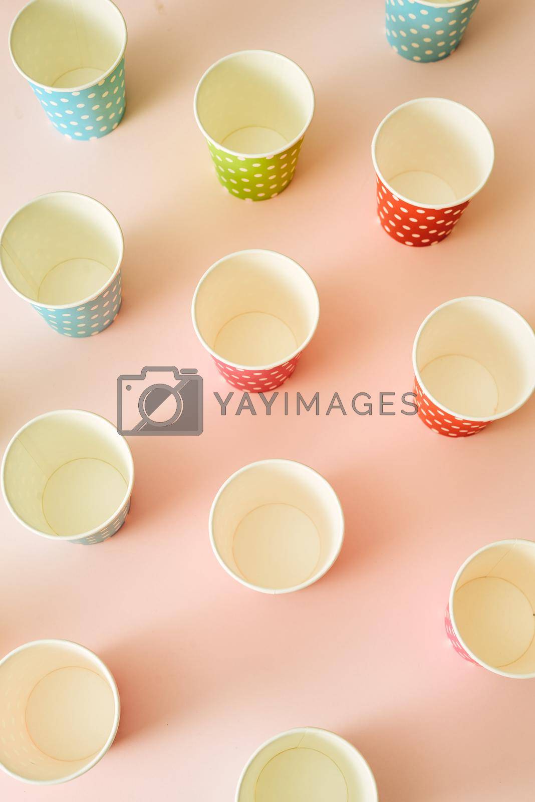 paper fashion cups on a delicate pink background