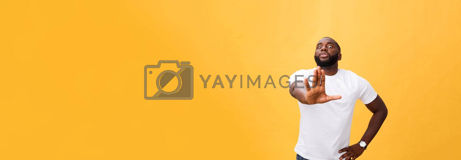 Royalty free image of Portrait shock and annoyed displeased young man raising hands up to say no stop right there isolated orange background. Negative human emotion, facial expression, sign, symbol, body language by Benzoix