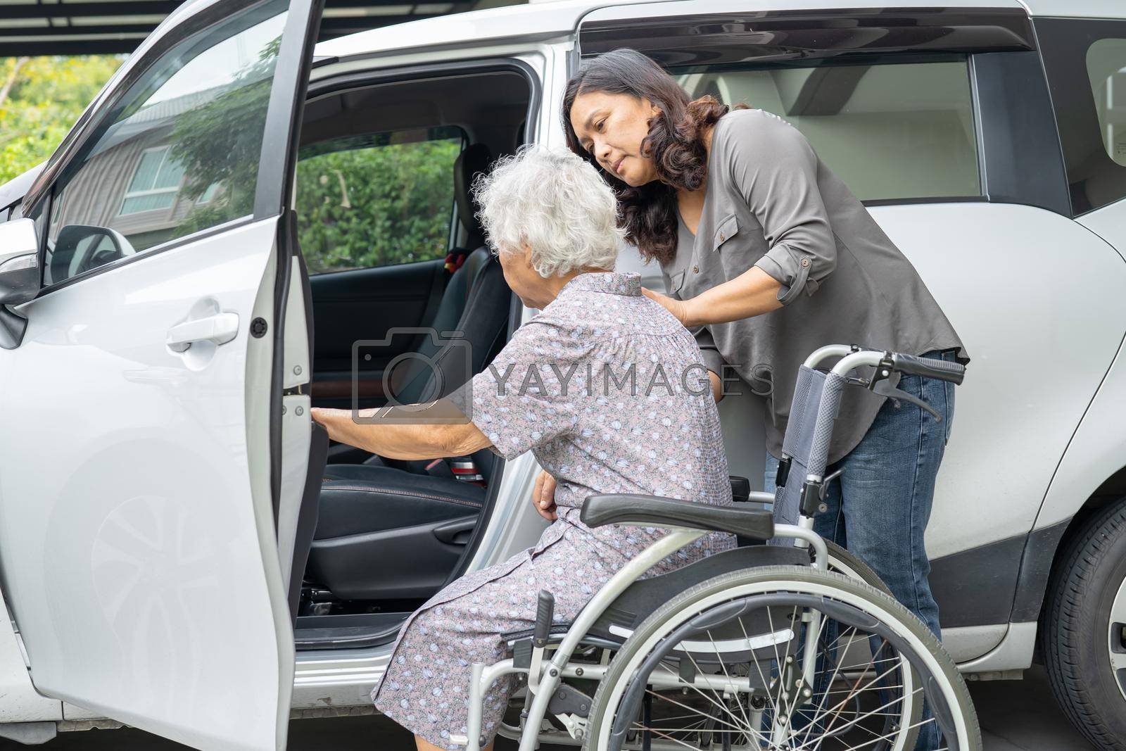 Royalty free image of Help and support asian senior or elderly old lady woman patient prepare get to her car. by pamai