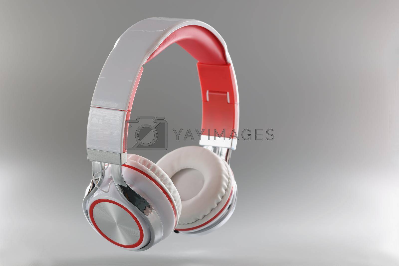 Royalty free image of Gray bluetooth wireless headphones, close-up by kuprevich