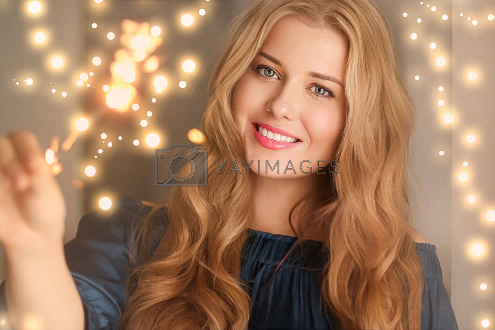Royalty free image of Holiday magic, Christmas and New Year celebration, happy woman with sparklers by Anneleven