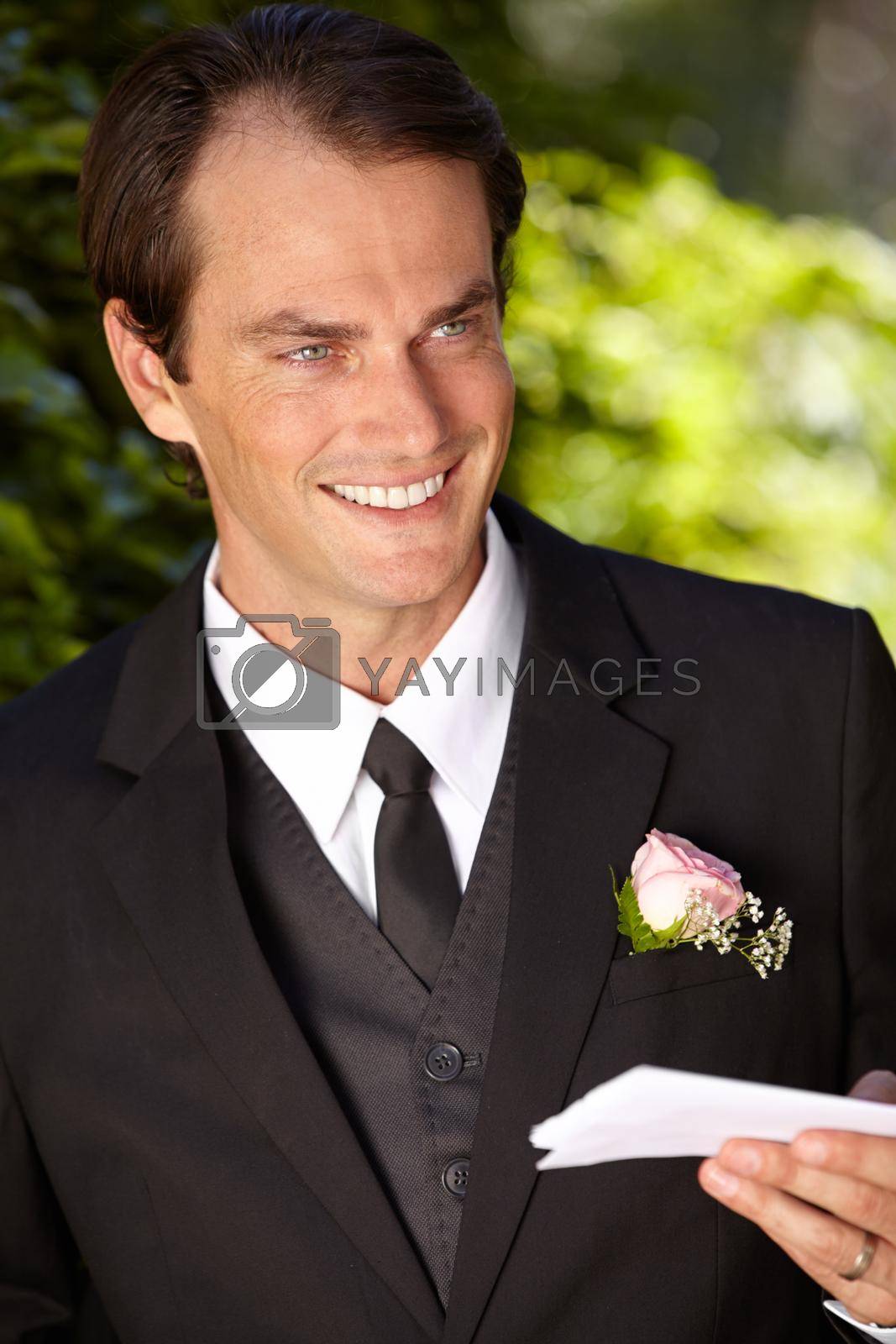 Royalty free image of Practising his vows one last time...Handsome groom practicing his vows. by YuriArcurs