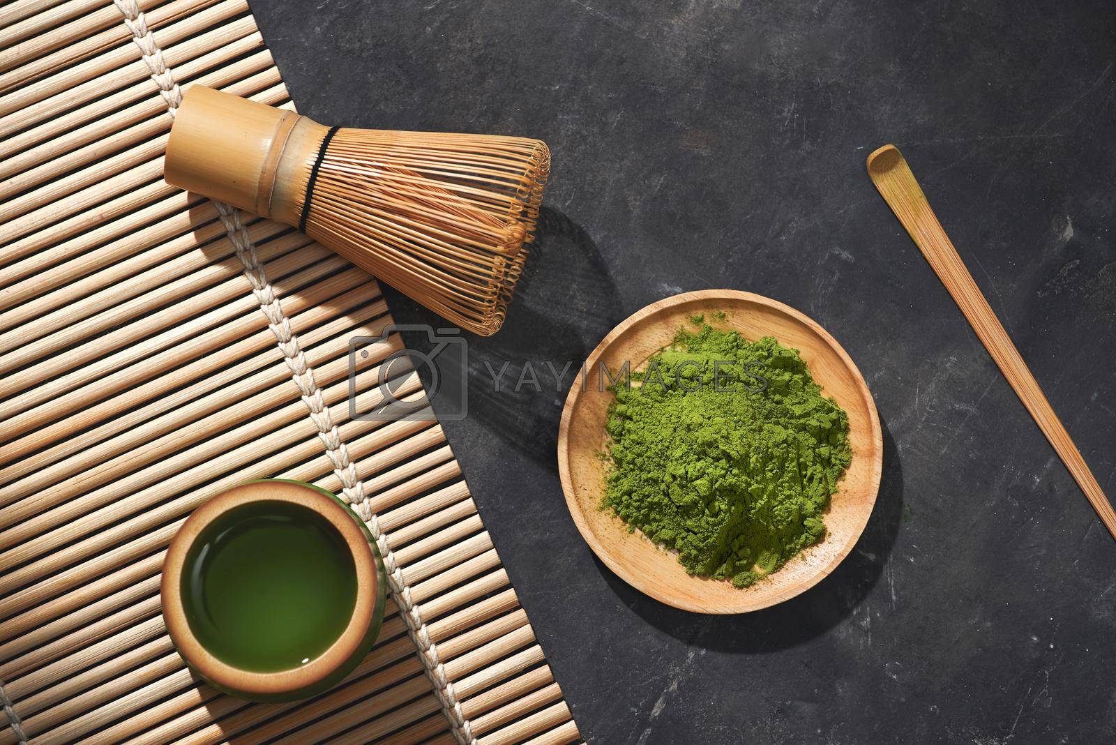 Royalty free image of Organic Green Matcha Tea on wooden table, copyspace by makidotvn