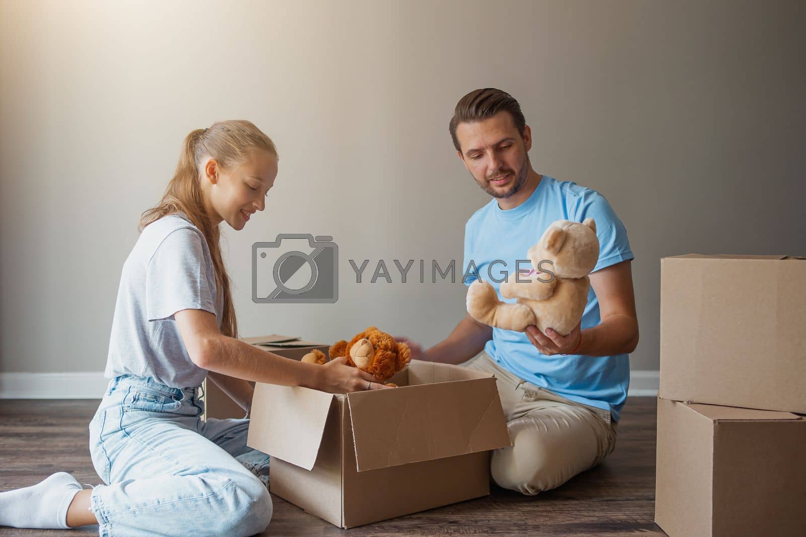 Royalty free image of Happy father with daughter have fun in their new home. Family enjoy their moving day by travnikovstudio