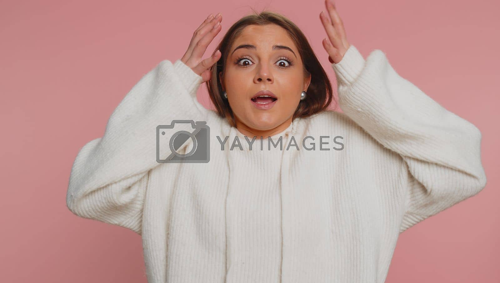 Royalty free image of Excited amazed woman surprise looking at camera with big eyes, shocked by sudden victory wow emotion by efuror