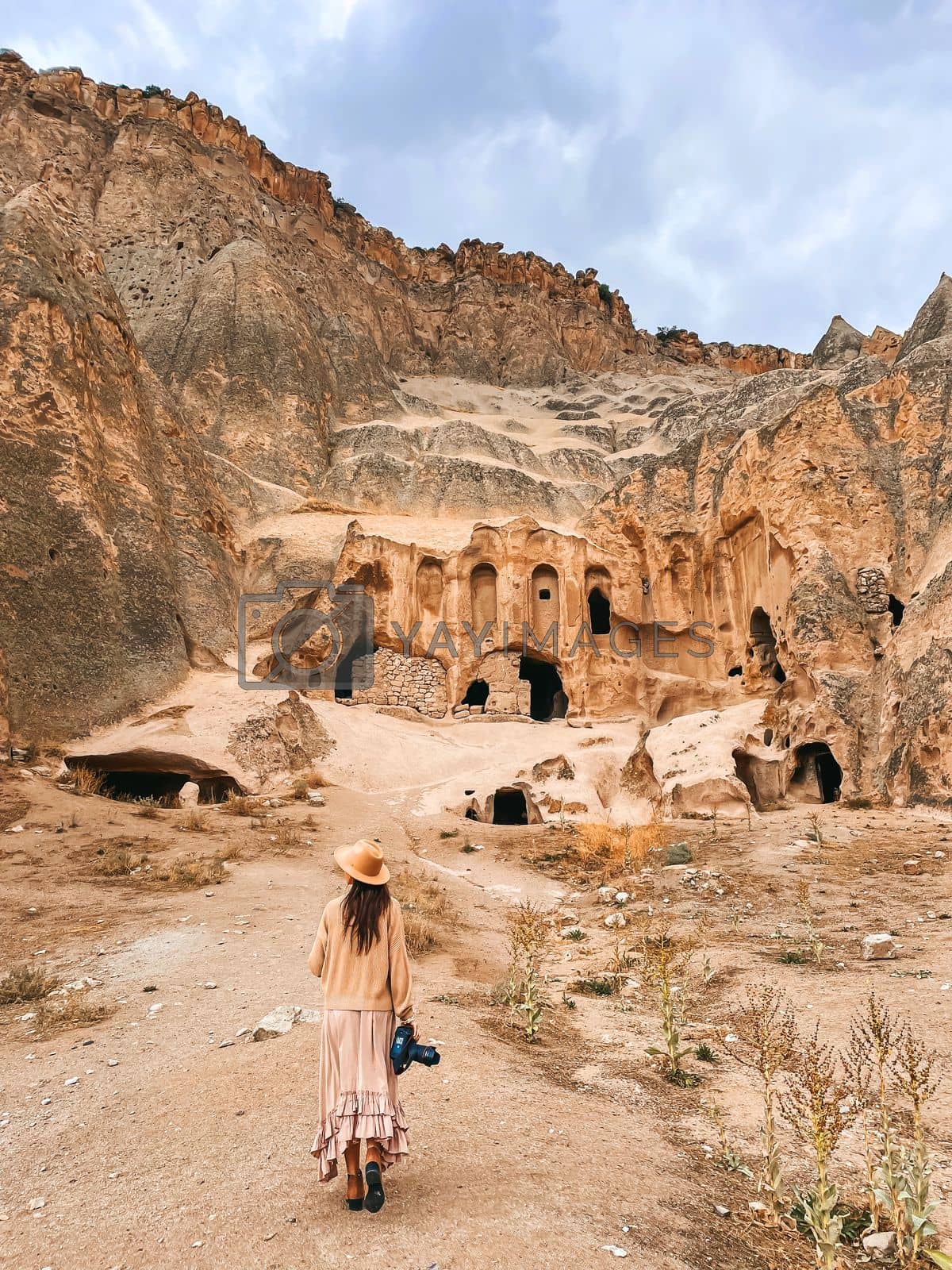 Royalty free image of Young woman in cave house in Cappadocia Turkey by travnikovstudio