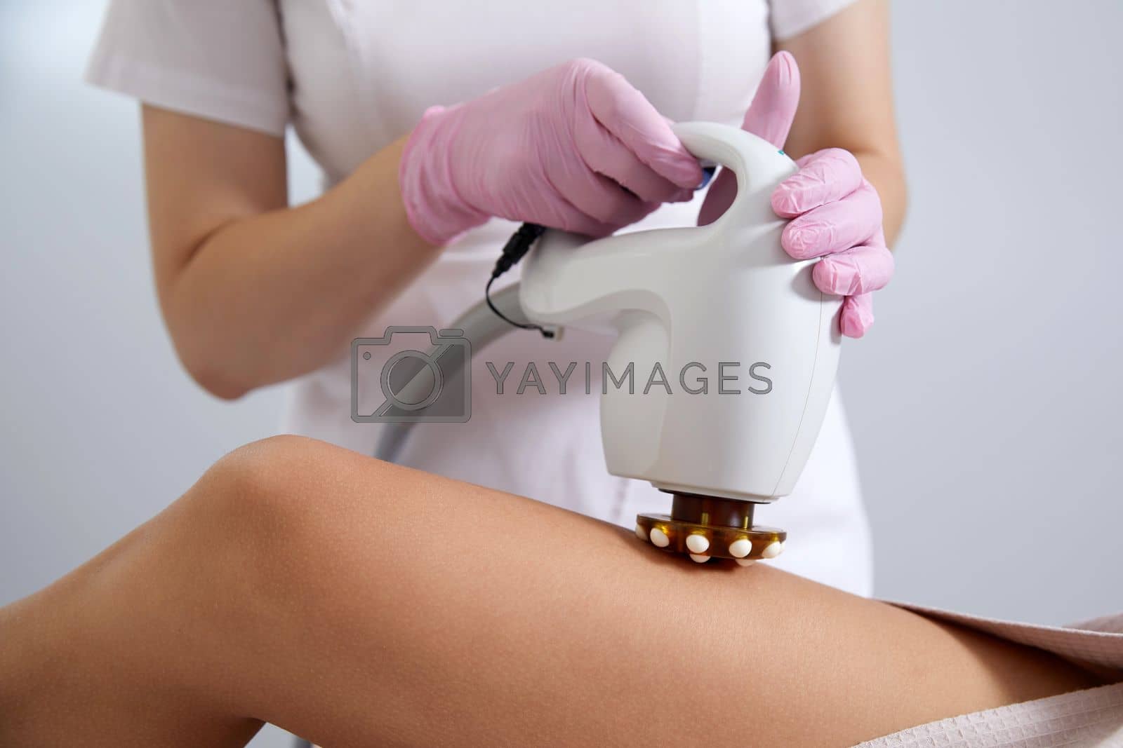 Royalty free image of Woman Having Laser Treatment On Thigh. Ultrasound cavitation body contouring treatment. Anti cellulite treatment by Mariakray