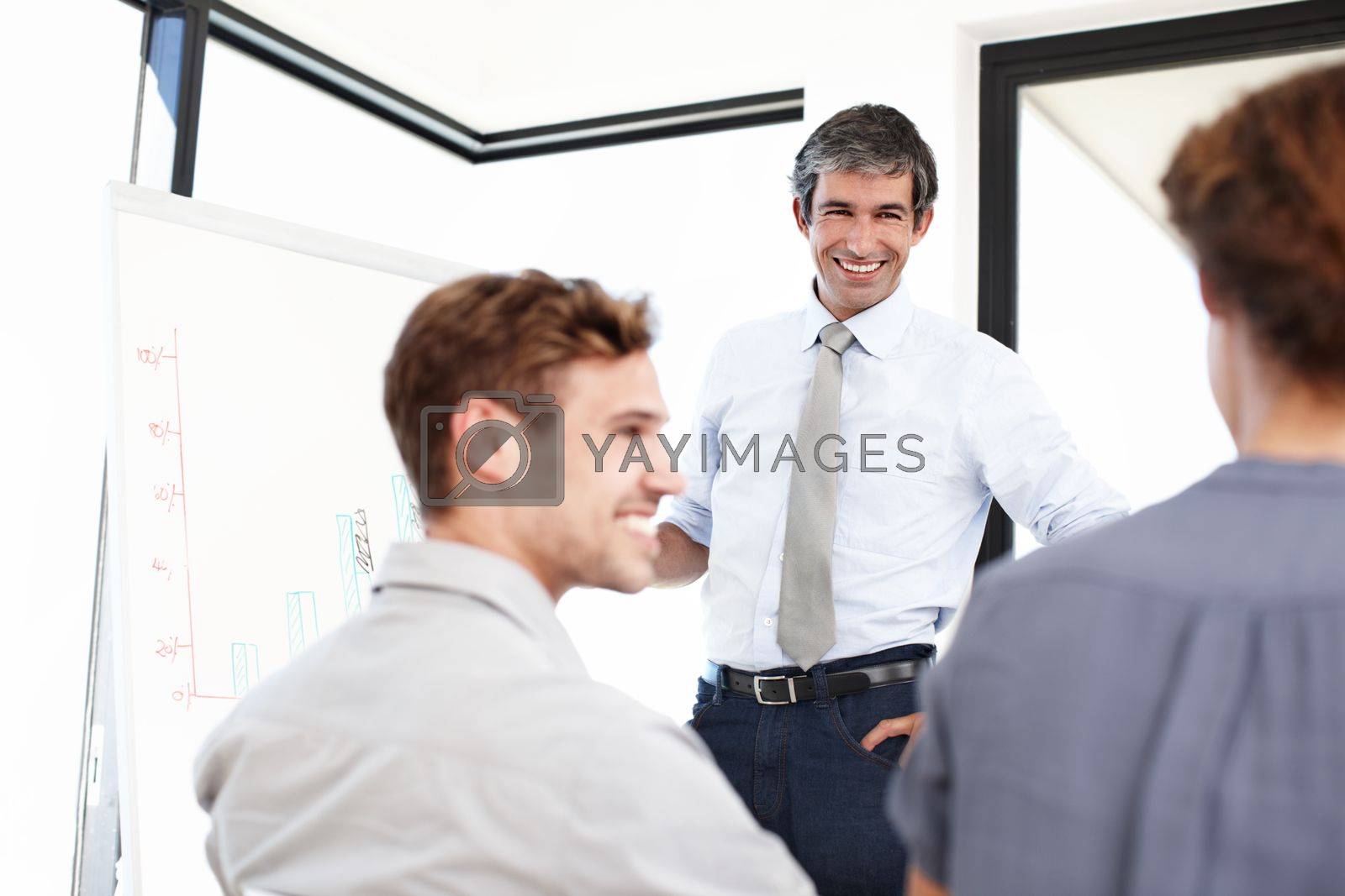 Royalty free image of Go through the financial quarter together. a group of business people having a financial meeting in a boardroom. by YuriArcurs