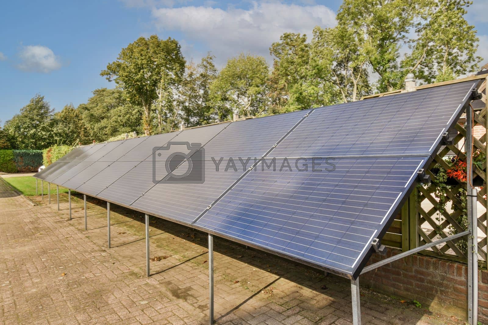 Royalty free image of the solar panels on the roof of a greenhouse by casamedia