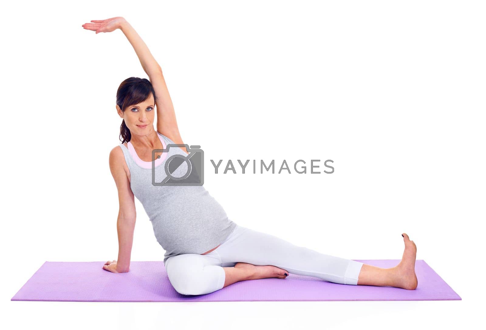 Royalty free image of Staying healthy during pregnancy. A pregnant woman doing pilates in a studio. by YuriArcurs