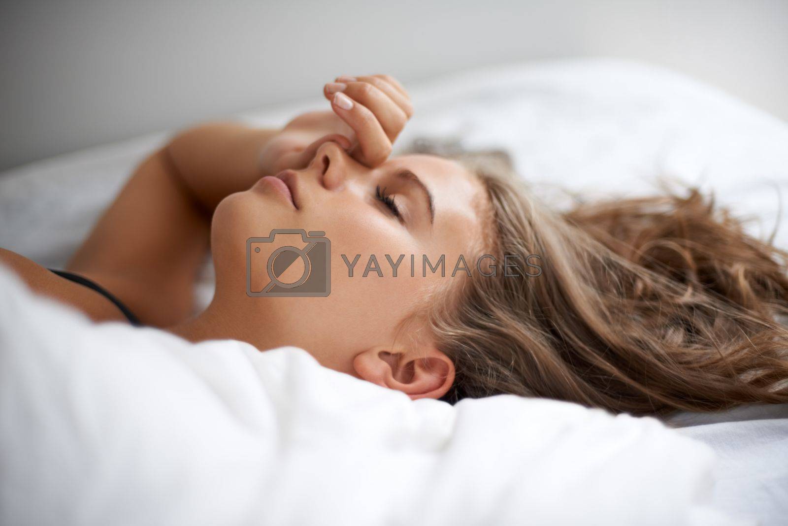 Royalty free image of Lost in her dreams. A beautiful young woman sleeping peacefully. by YuriArcurs