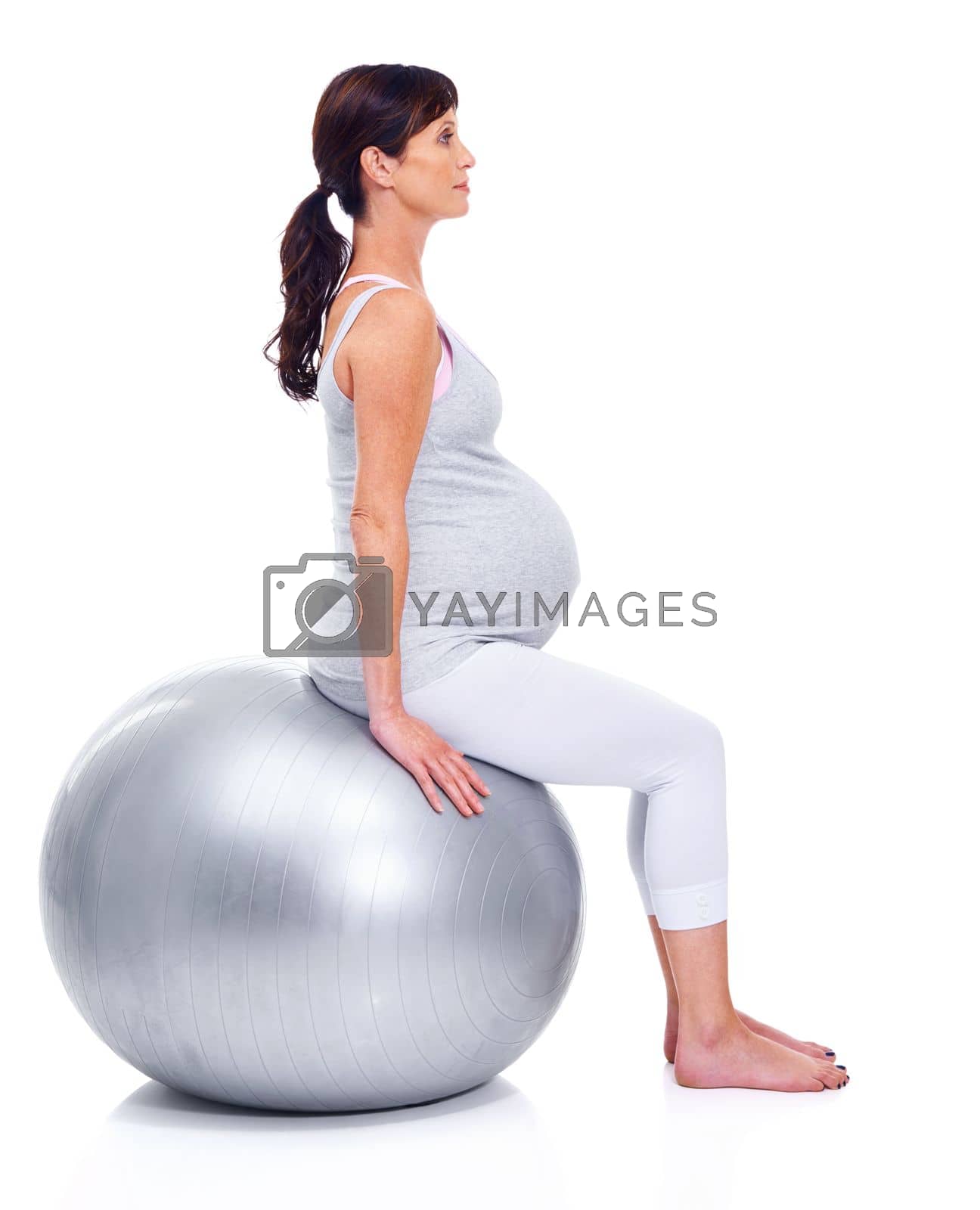 Royalty free image of Pilates for pregnancy. A pregnant mother sitting on a pilates ball. by YuriArcurs