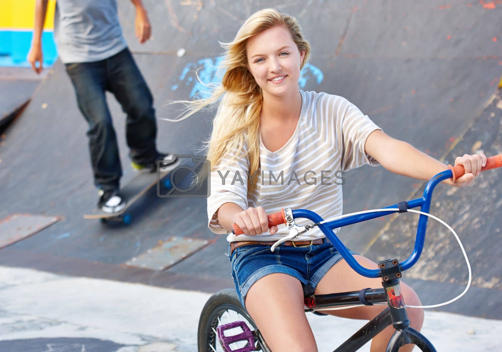 Royalty free image of Chilling at the skatepark. a teenage girl at a skatepark. by YuriArcurs