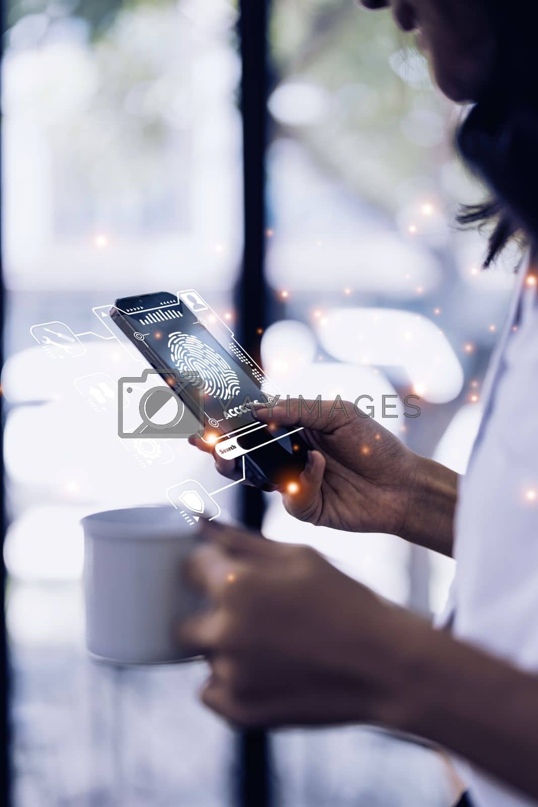 Royalty free image of A business woman using face scan to cyber security for his saving account, business, technology and future Concept by itchaznong