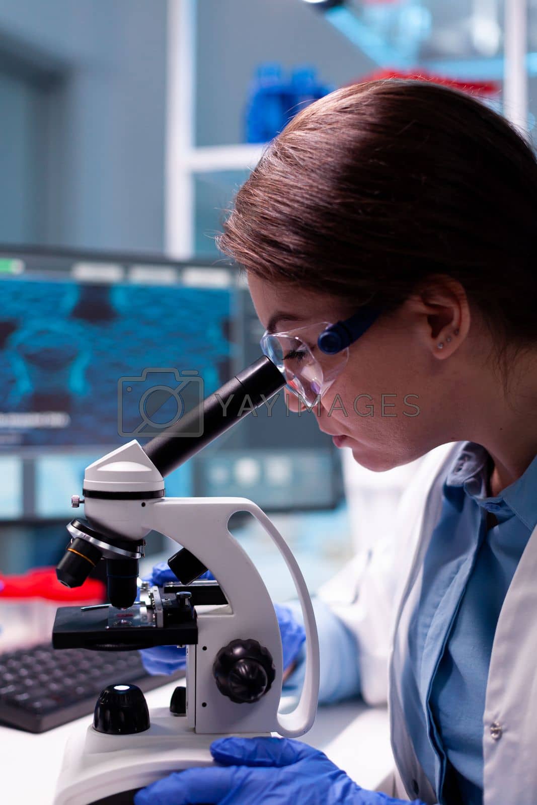 Royalty free image of Close up of chemical technician microbiology analysing sample by DCStudio