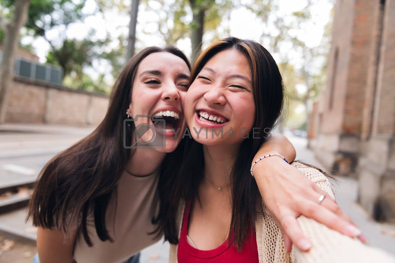 Royalty free image of women laughing and having fun while dating by raulmelldo