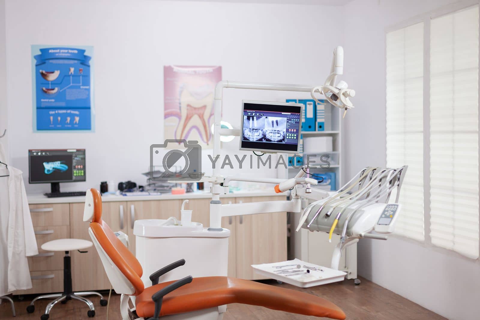 Royalty free image of Dental chair and other accesorries used by dentist by DCStudio