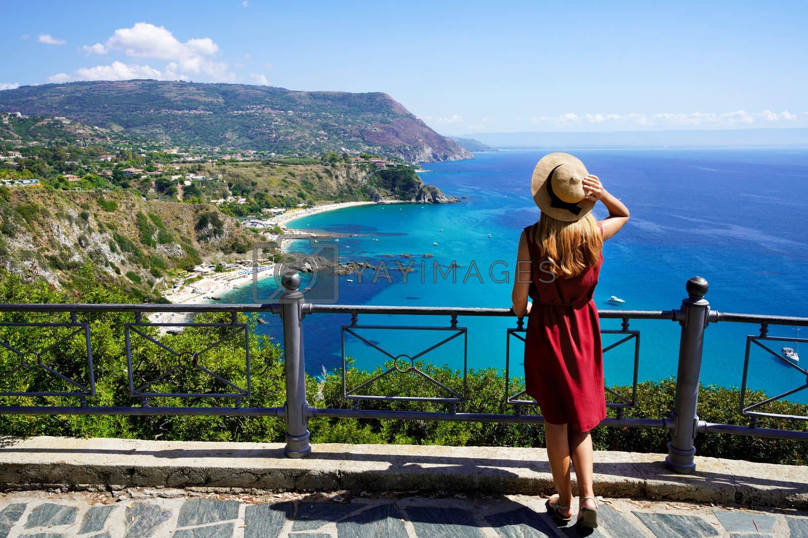 Royalty free image of Tourism in Italy. Panoramic view of young woman with hat in Capo Vaticano on the Coast of the Gods, Calabria, Italy. by sergio_monti