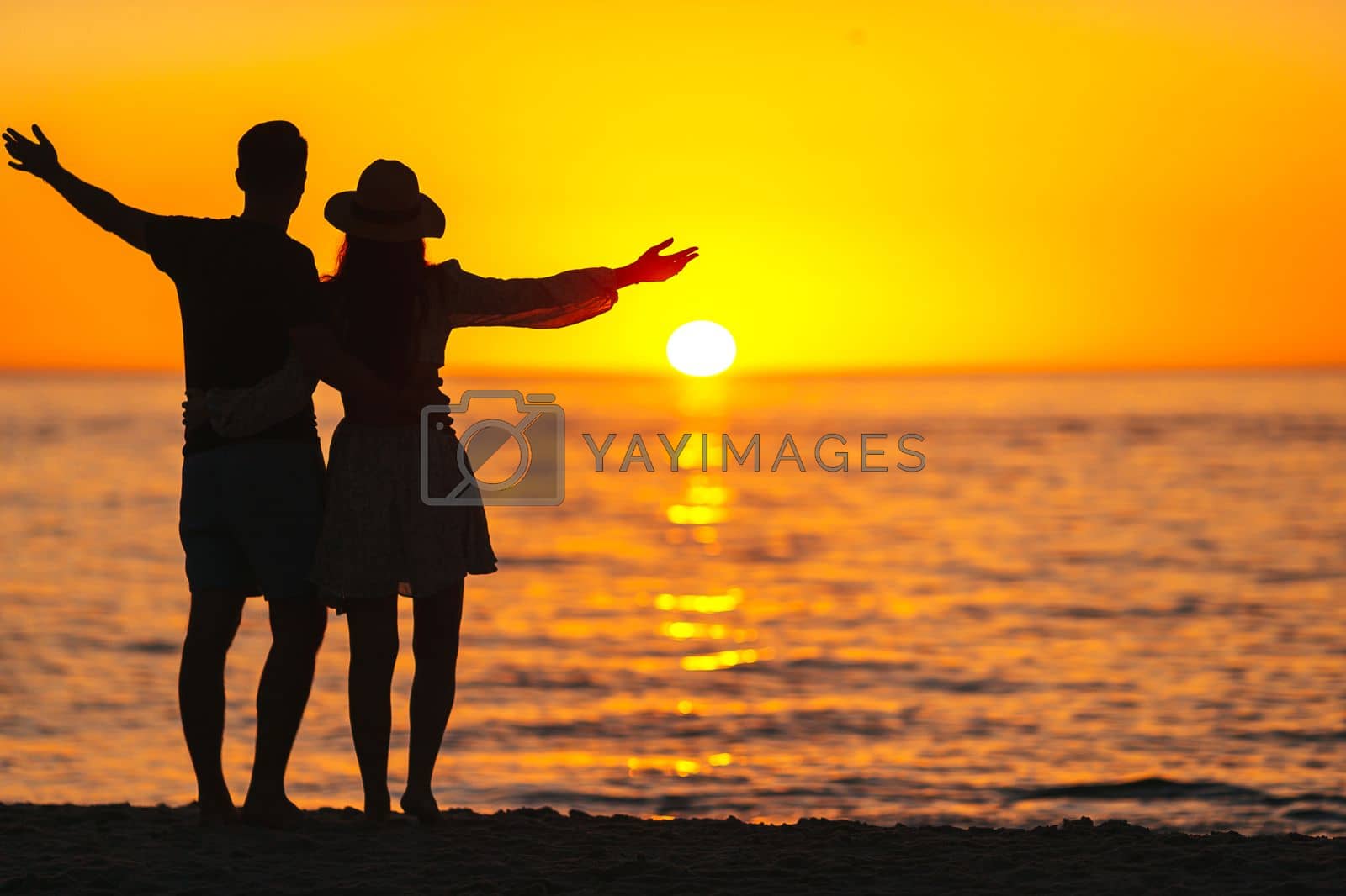 Royalty free image of Young couple in love on the beach summer vacation. Happy man and woman enjoy time together by travnikovstudio