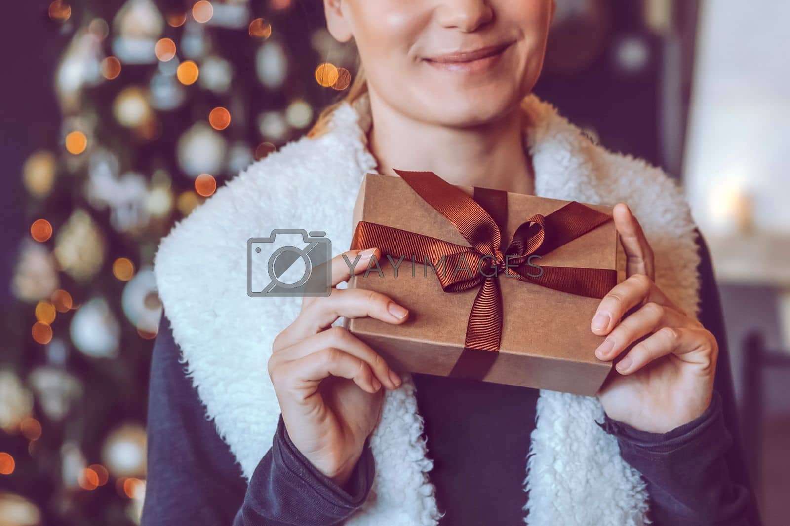 Royalty free image of Happy Woman with Christmas Gift by Anna_Omelchenko
