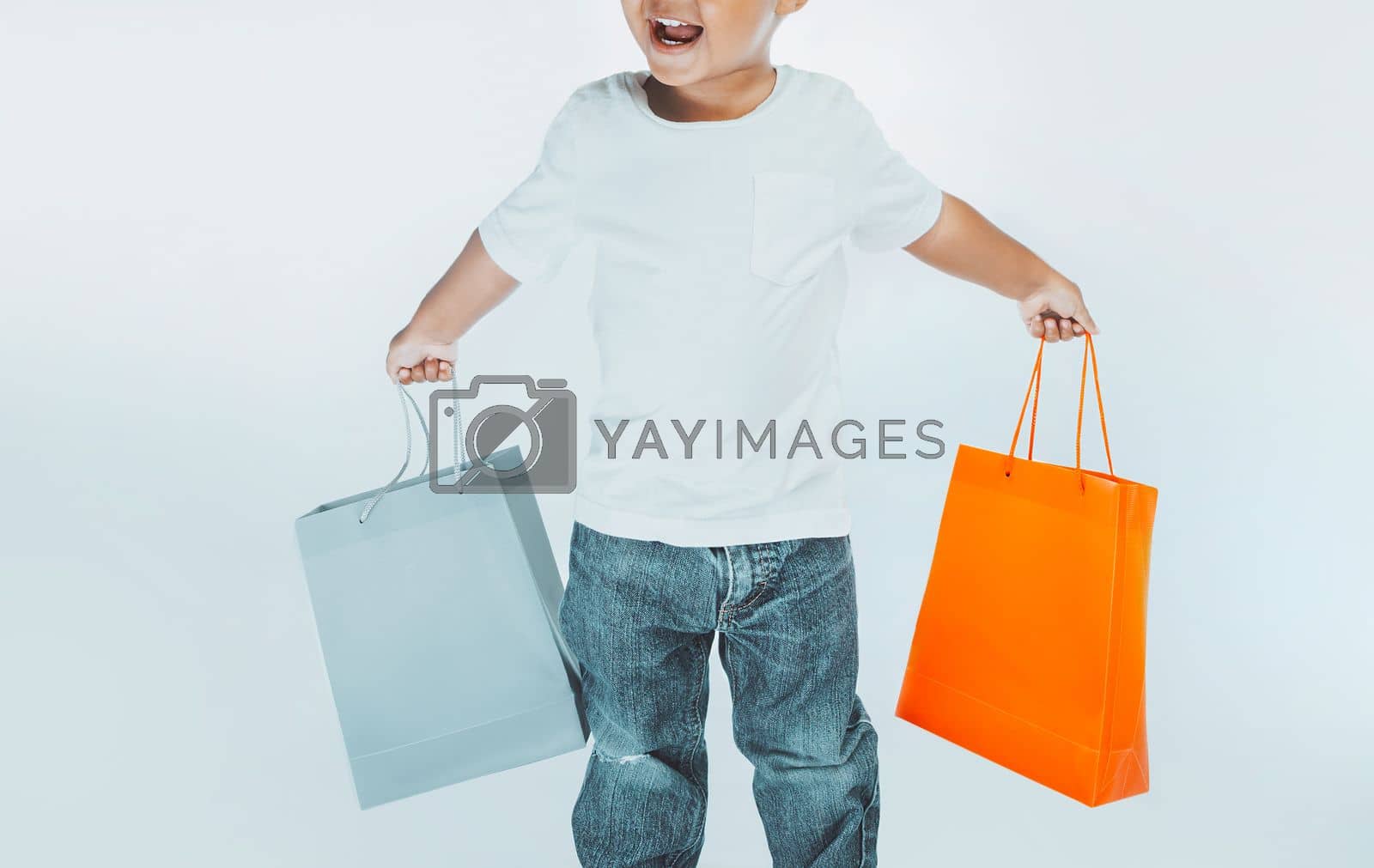 Royalty free image of Little Boy with Shopping Bag by Anna_Omelchenko