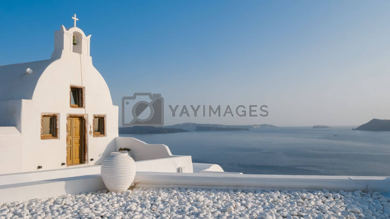 Royalty free image of Oia Santorini Greece on a sunny day during summer with whitewashed homes and churches, Greek Island by fokkebok