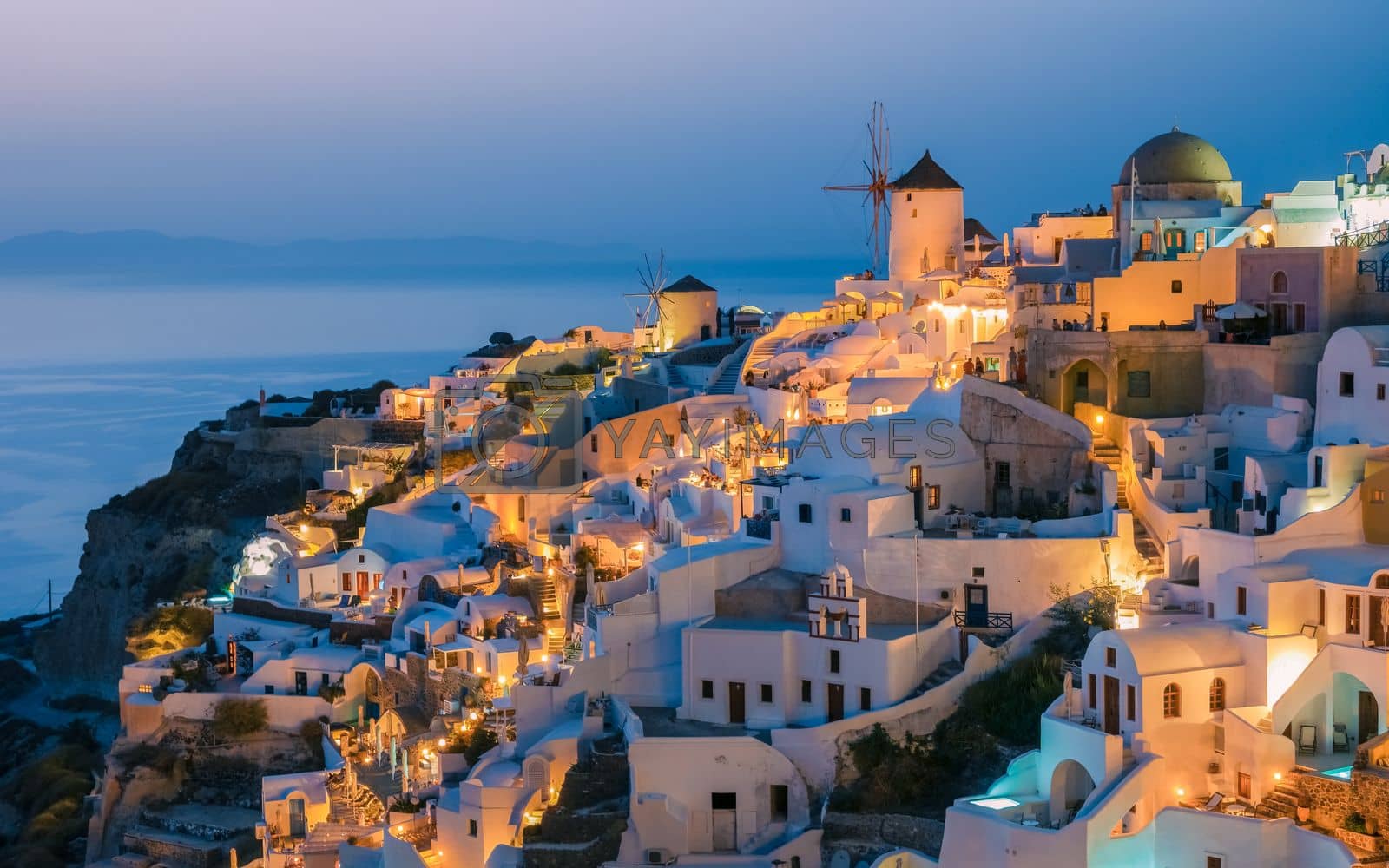 Royalty free image of Sunset at Oia Santorini Greece during summer with whitewashed homes and churches, Greek Island by fokkebok