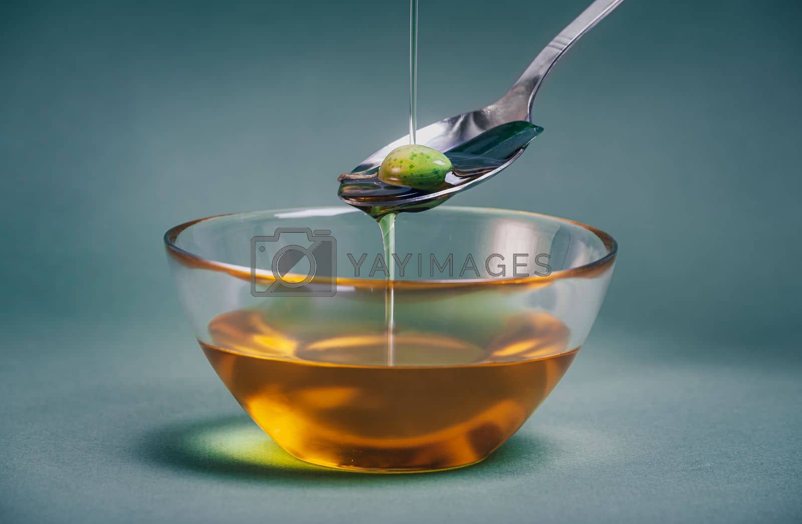 Royalty free image of Chef pouring extra virgin olive oil by Anna_Omelchenko