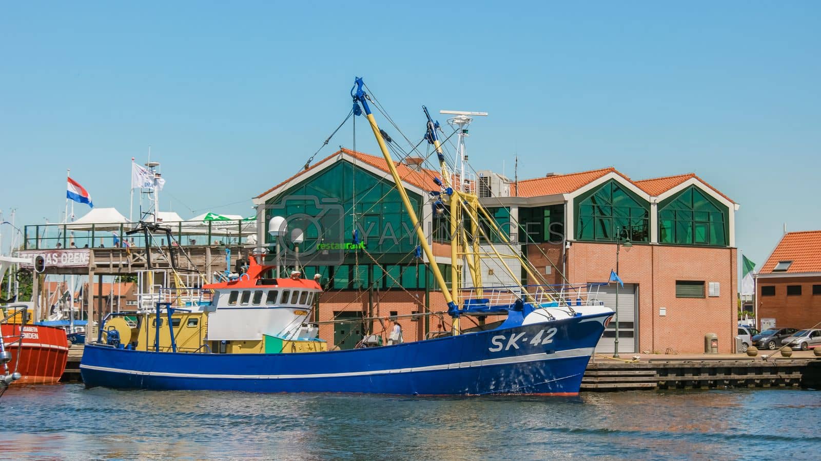 Royalty free image of Urk Flevoland Netherlands May 2017 fishing harbor of Urk Holland with fishing boats Fishing village Urk by fokkebok