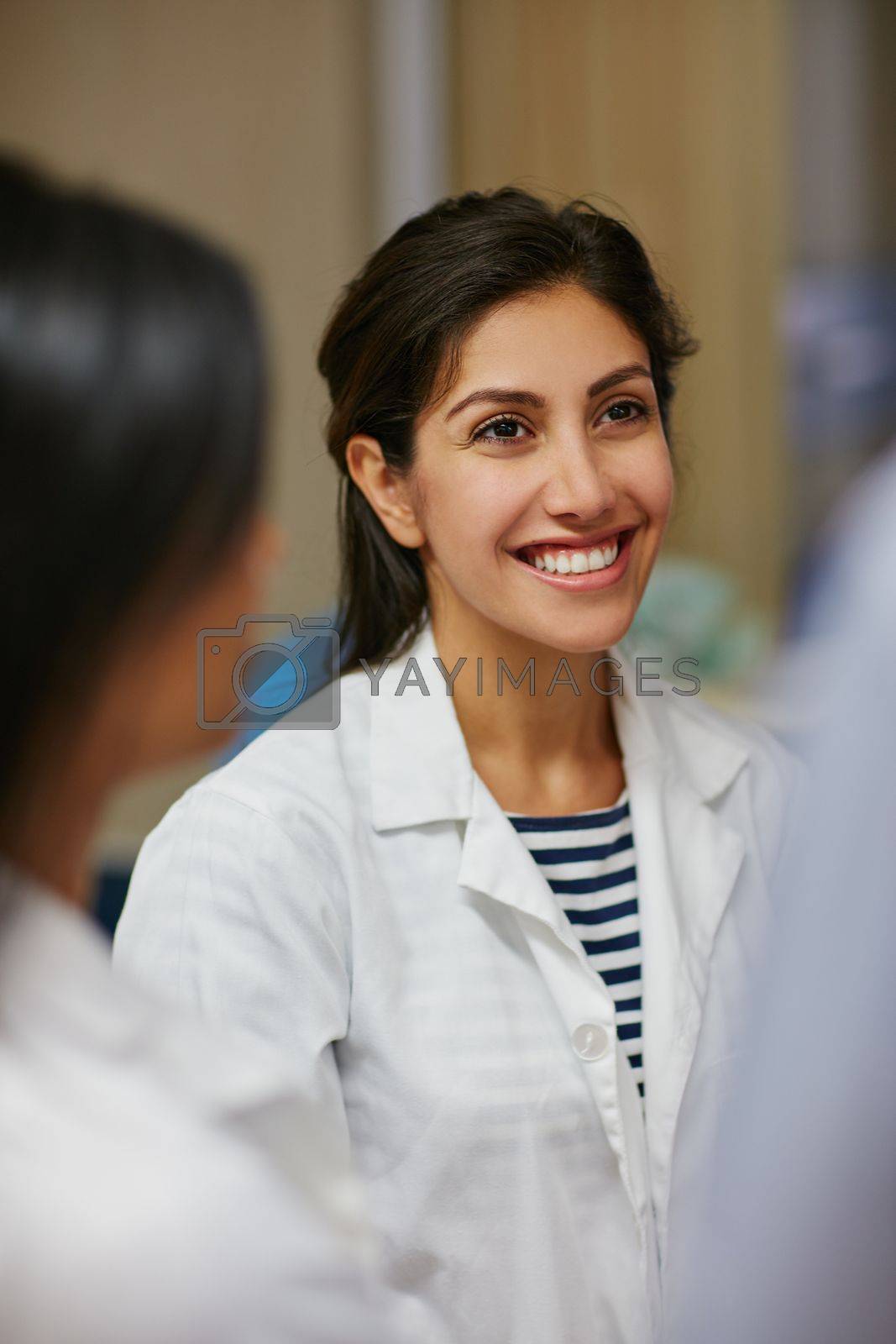 Royalty free image of Sharing her healthcare ideas. a doctor working in a hospital. by YuriArcurs