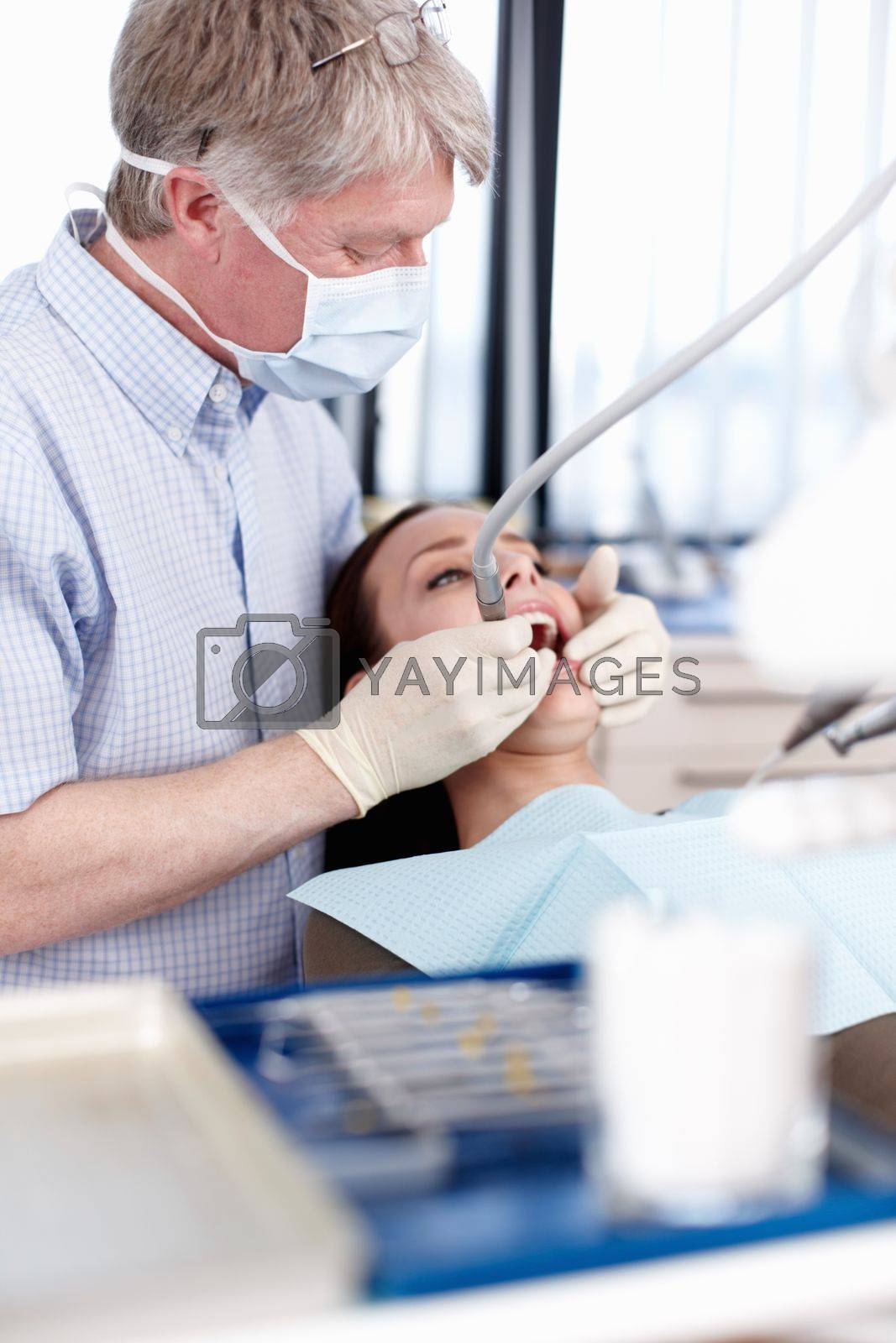 Royalty free image of Dental treatment. Portrait of patient ready for dental treatment in clinic. by YuriArcurs