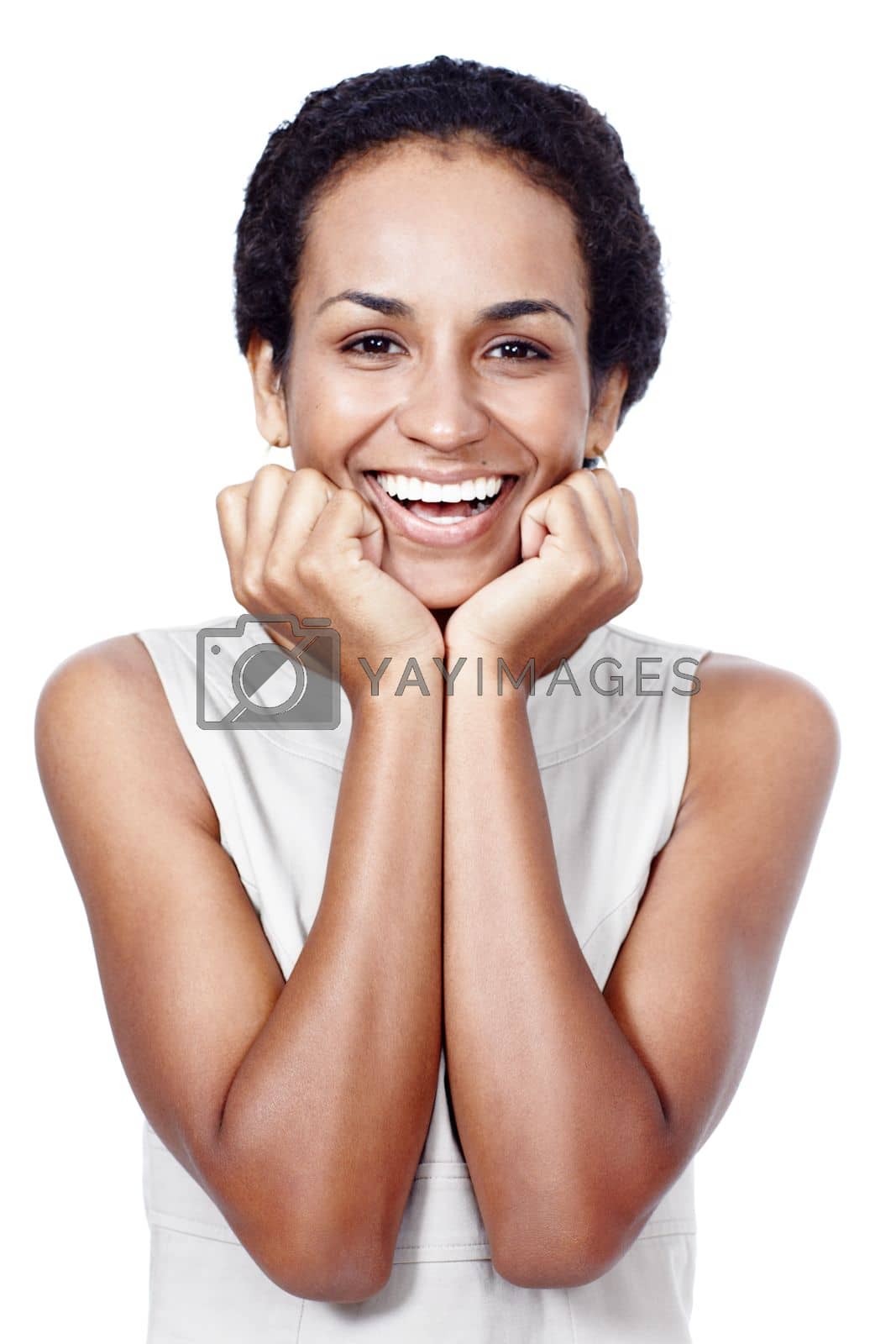 Royalty free image of Shes got a winning smile. Studio shot of a confident woman posing against a white background. by YuriArcurs