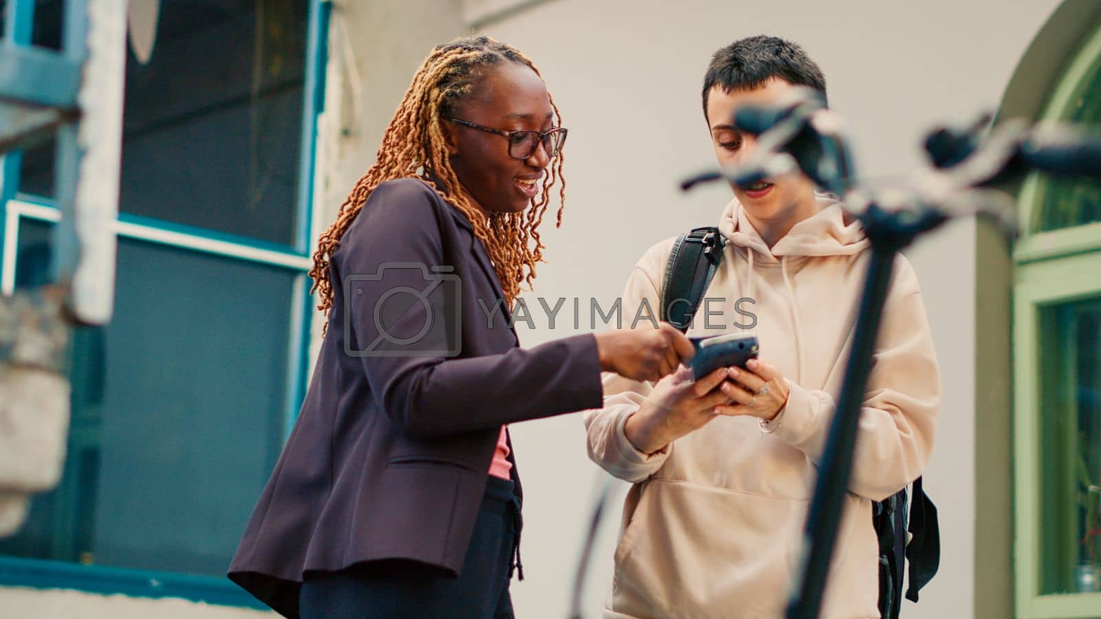 Royalty free image of Female customer using credit card to pay for food order by DCStudio