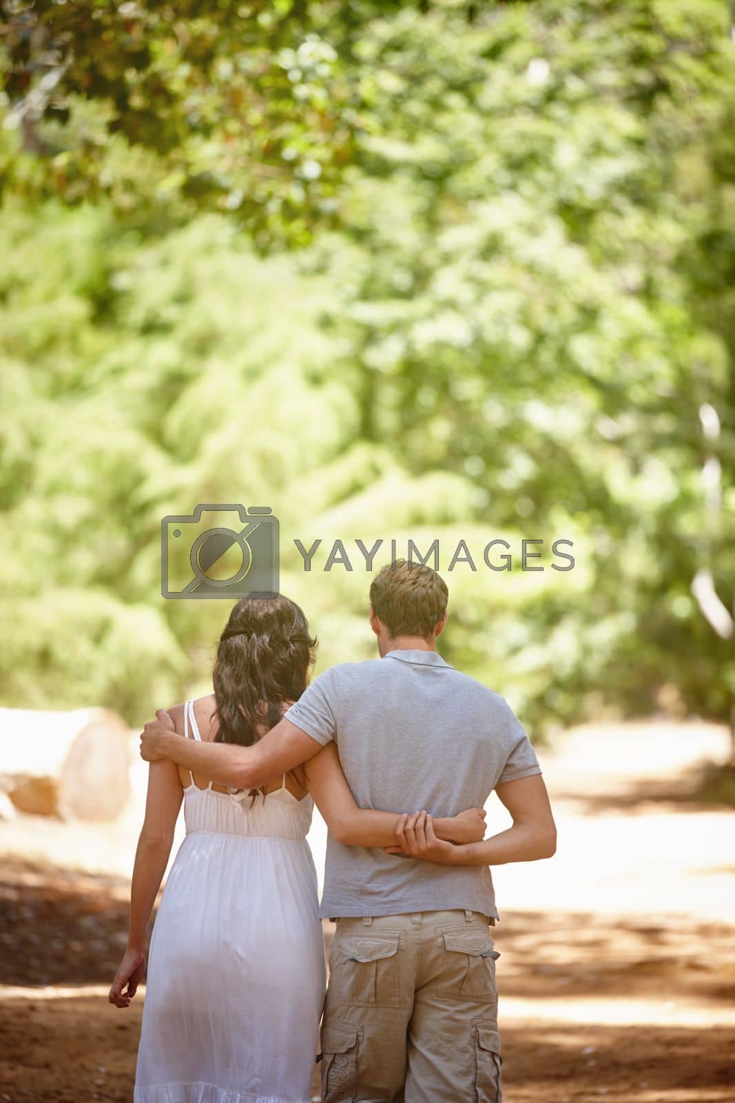 Royalty free image of Together forever. a happy couple enjoying a carefree day together in the forest. by YuriArcurs