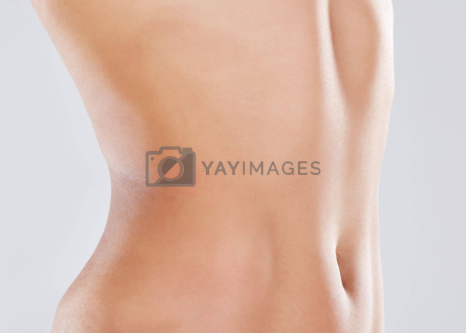 Royalty free image of Woman, stomach and slimming wellness or skincare for plastic surgery, liposuction or digestion nutrition in white background. Model, belly and tummy tuck or cosmetics dermatology healthcare in studio by YuriArcurs