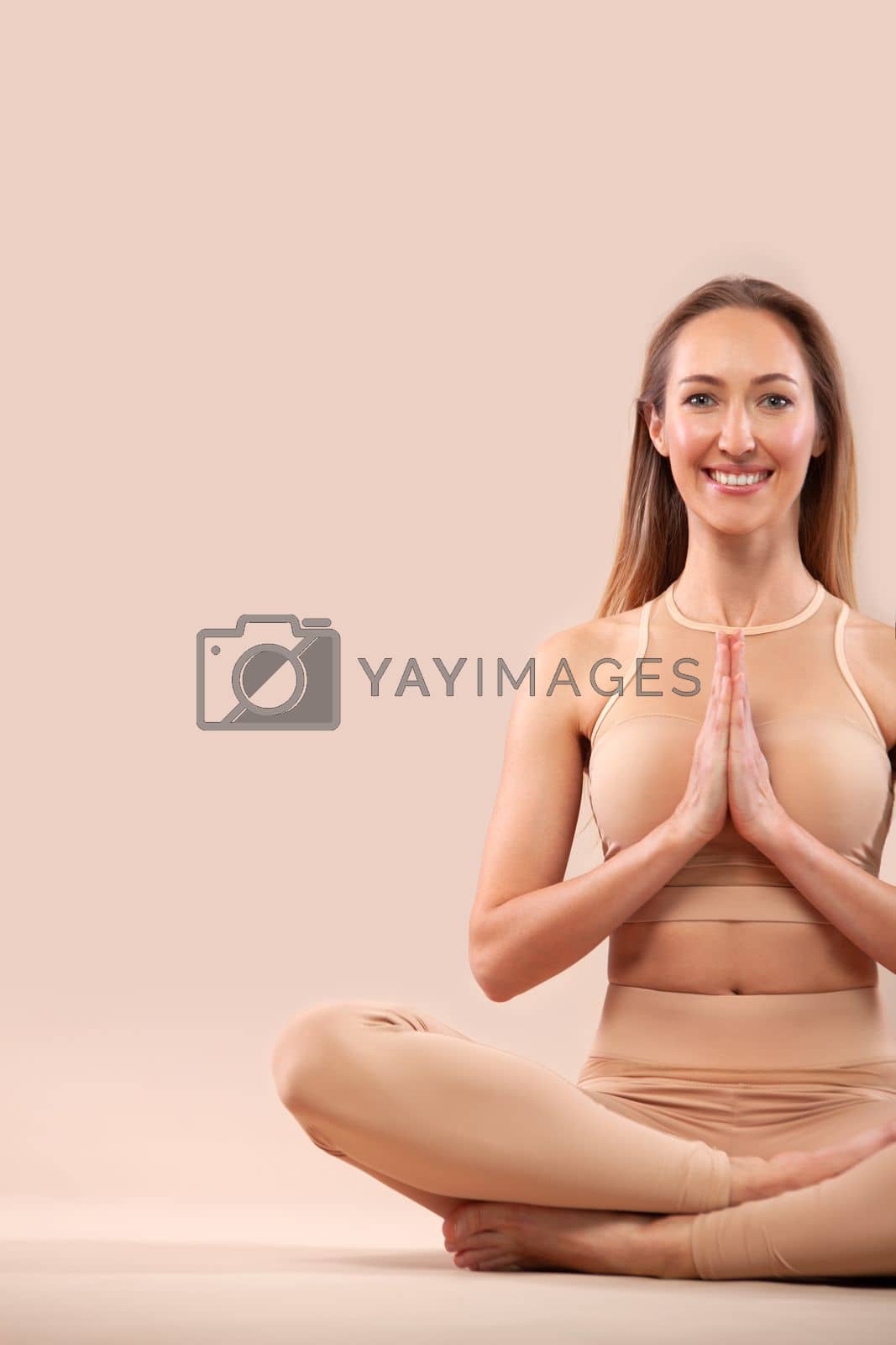 Royalty free image of Download picture for yoga classes ads. Yoga asana Indoor. Sports recreation. Woman in yoga pose. by MikeOrlov