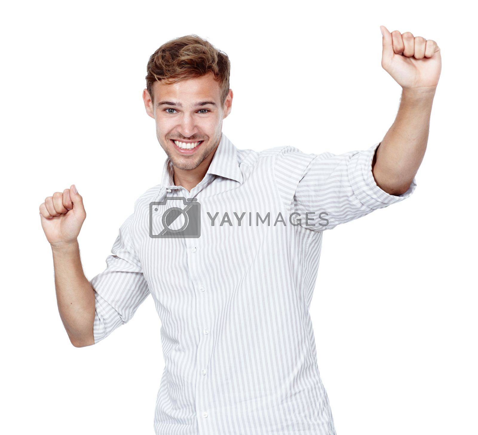 Royalty free image of Yay for me. Studio shot of a young man raising his arms in celebration of a success. by YuriArcurs