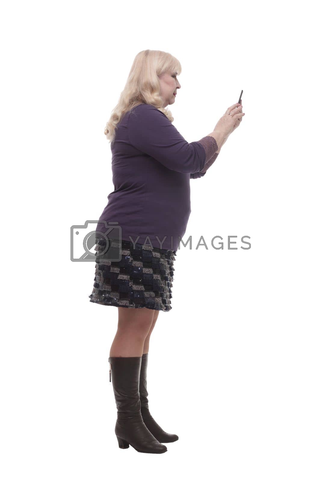 Royalty free image of full-length. casual mature woman with a smartphone . by asdf