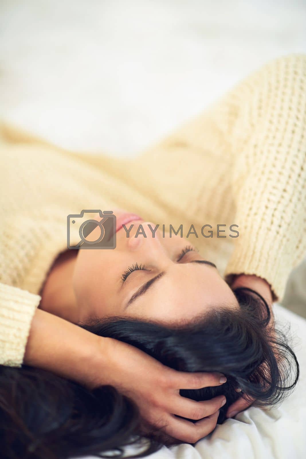 Royalty free image of Enjoying the peace and quiet. a young woman sleeping on her bed. by YuriArcurs