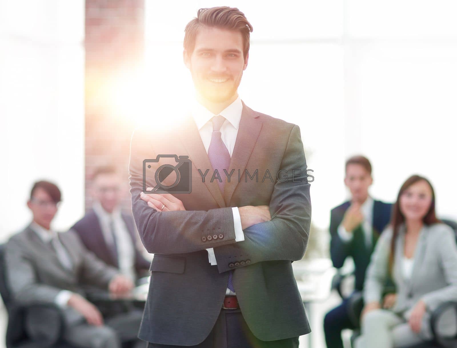 Royalty free image of Successful businessman at the office leading a group by asdf