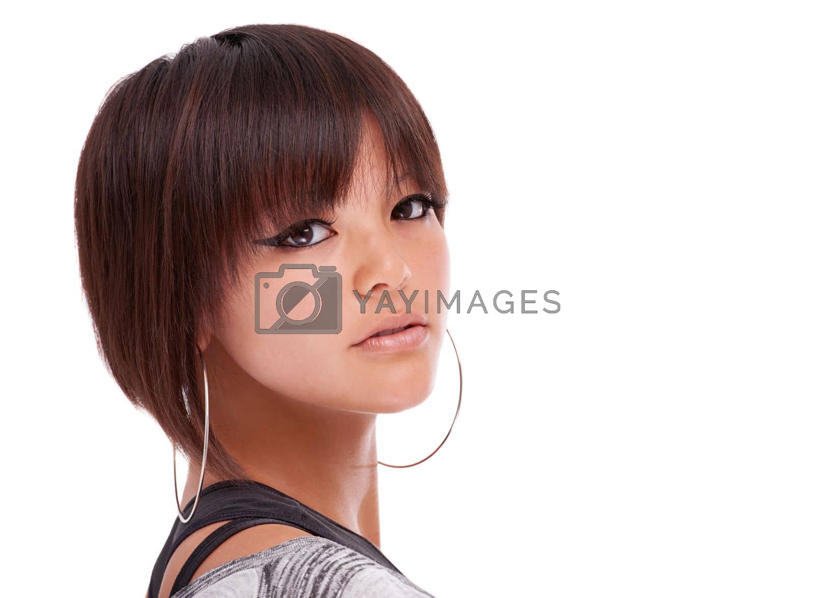 Royalty free image of Its all in a glance...Studio portrait of a beautiful young woman with a trendy hairstyle looking over her shoulder. by YuriArcurs