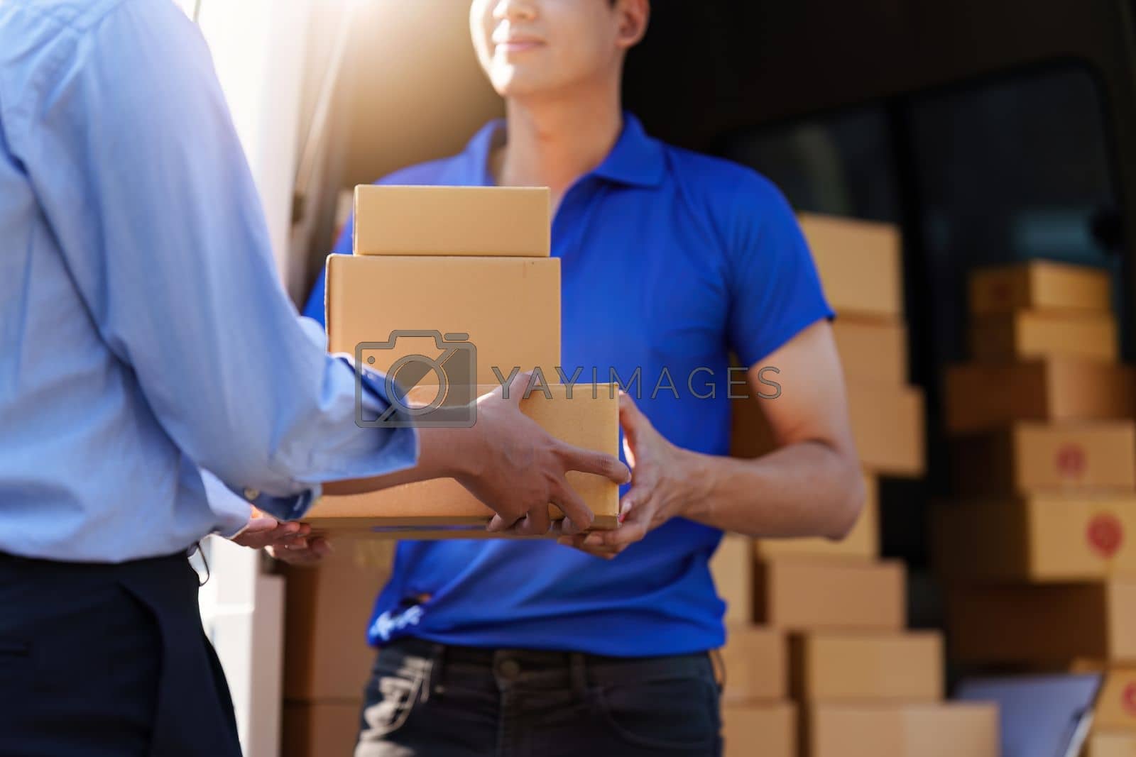 Royalty free image of Asian Man hand accepting a delivery boxes. delivery logistic concept by itchaznong