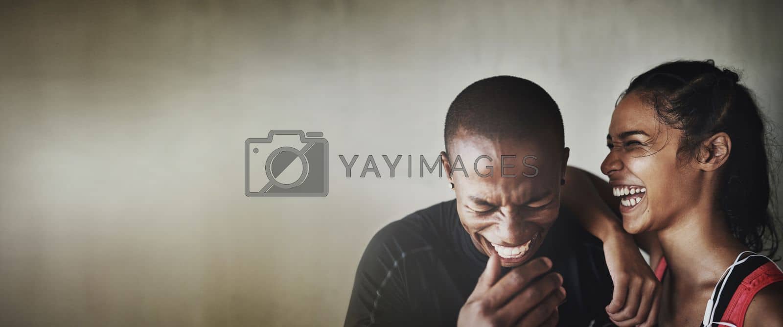 Royalty free image of Fitness, mockup or laughter with a black couple in studio on a gray background for health and humor. Exercise, mock up or funny with a man and woman athlete laughing against a wall in the gym by YuriArcurs