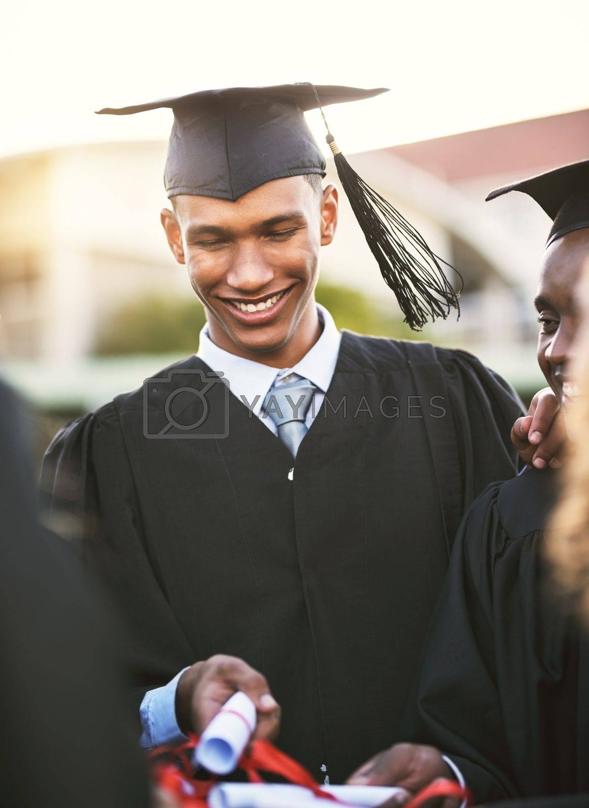 Royalty free image of Education is the key to success. a group of students holding their diplomas together on graduation day. by YuriArcurs