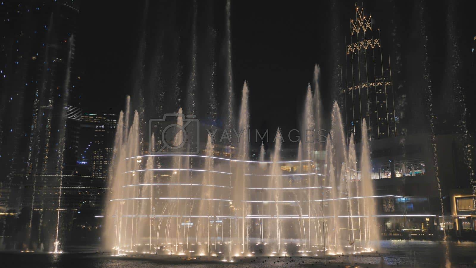 Royalty free image of Dancing fountains in Dubai in the evening. by DovidPro