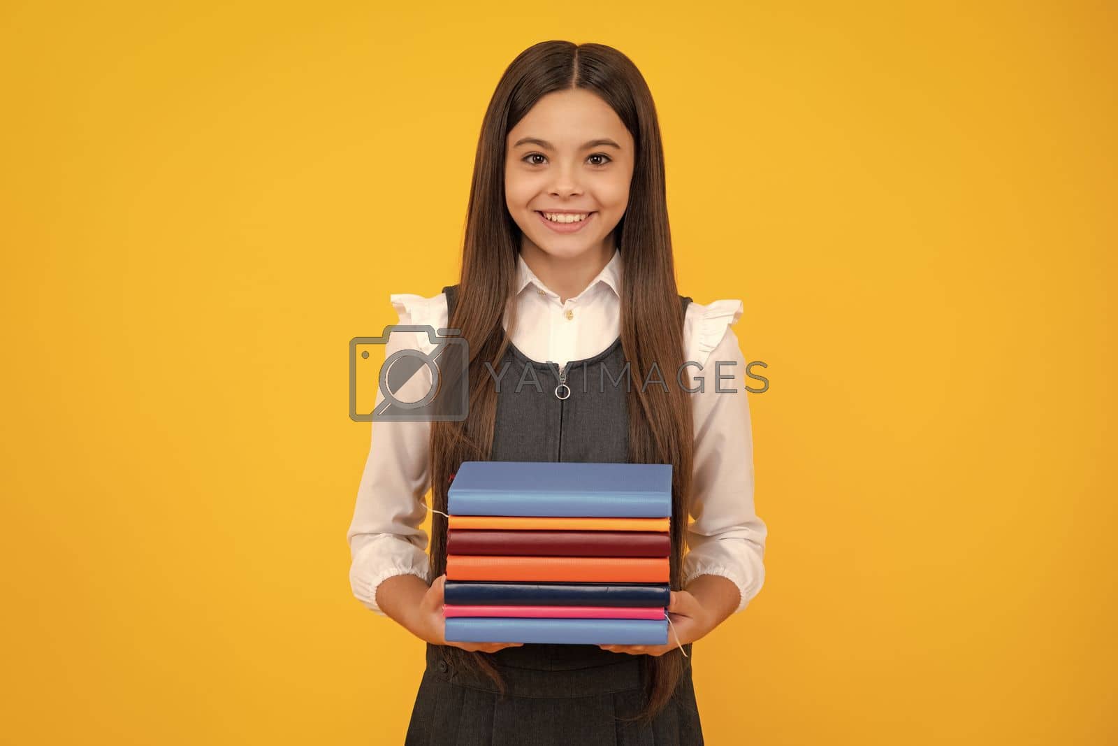Royalty free image of School child with book. Learning and education. by RedFoxStudio